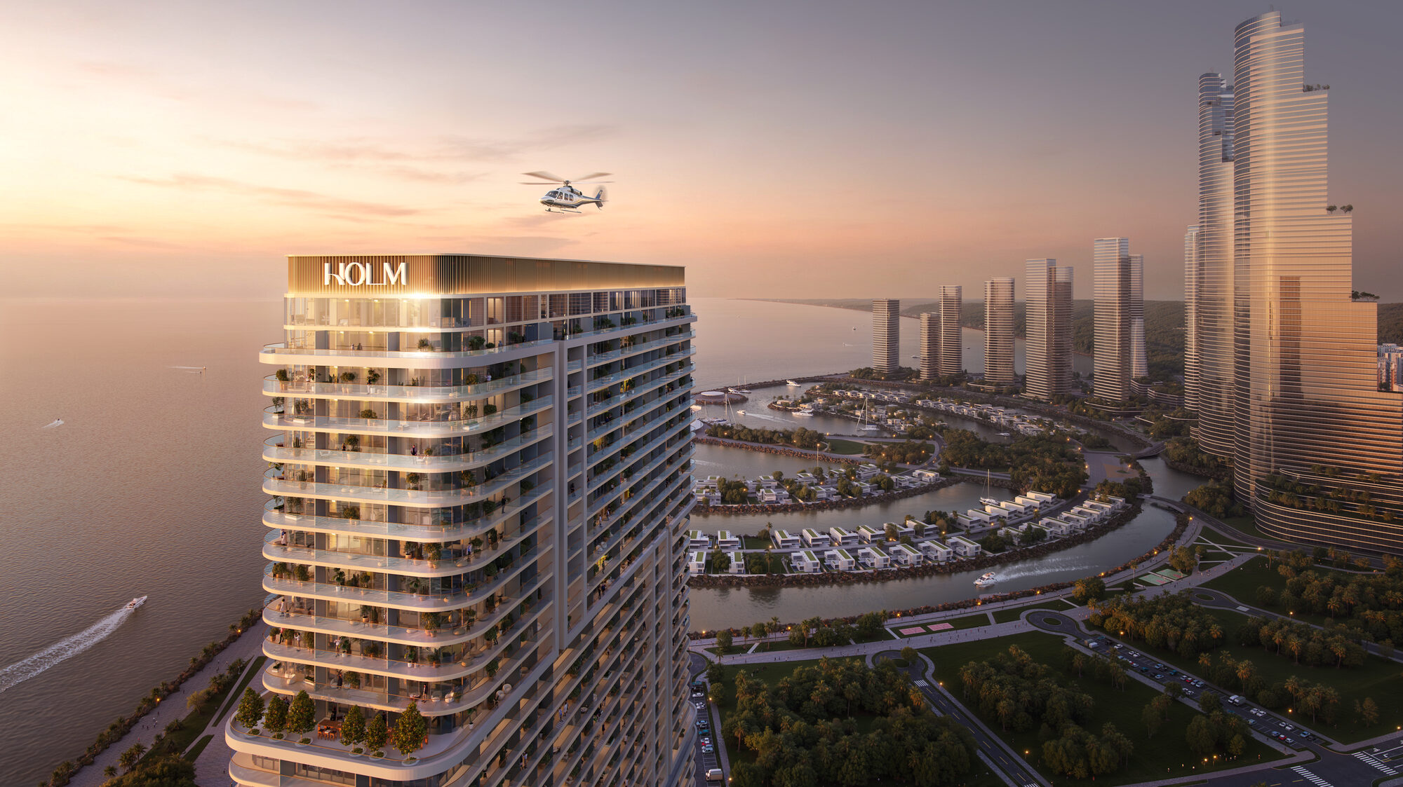 ONE PENINSULA Batumi by HOLM Developments — illuminated HOLM tower at sunset seen from a helicopter above Ambassadori Island